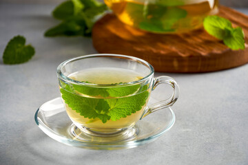 Fresh natural melissa , lemon balm herbal tea in glass cup.	