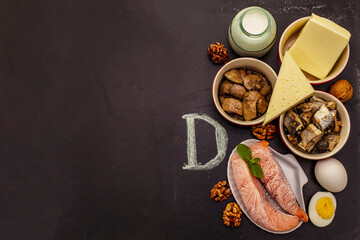 Fototapeta na wymiar Foods containing vitamin D. Cheese, eggs, butter, nuts, milk, sardine