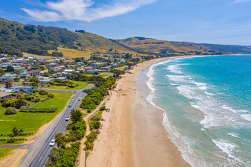 People are enjoying a sunny day on a beach at Apollo Bay, Australia © dudlajzov