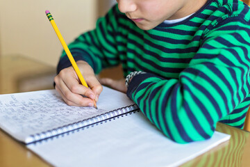 child writing cursive