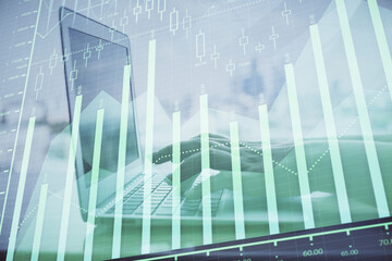 Double exposure of woman hands typing on computer and forex chart hologram drawing. Stock market...