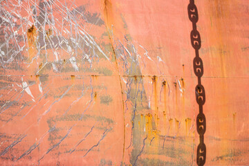 Rusty anchor chain on large ship at sea