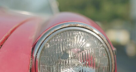 Close up of features of vintage red classic collectible convertible car
