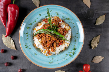 Turkish and Arabic Traditional Ramadan Kebab Ali Nazik  - Beef meat on yogurt in traditional plate. Recipe meal made with breads and with yoghurt, parsley and minced meat. Ground yogurt. middle easter