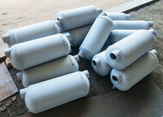 Grey flow through air collector tanks on the ground. Industry concept.