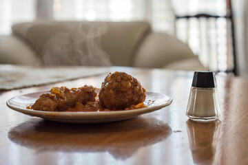 steaming meatloaf with pork sausage tomato sauce and salt