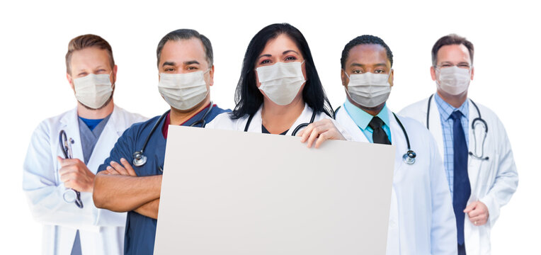 Variety Of Medical Healthcare Workers Wearing Medical Face Masks Holding Blank Sign Amidst The Coronavirus Pandemic