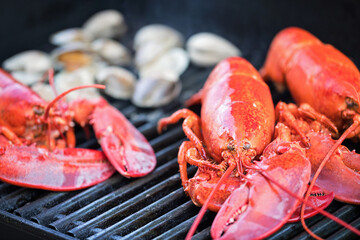 lobsters and clams on a grill