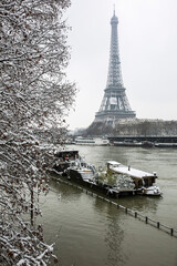 Paris with Magnifique Eifel tower covered with snow. France, Europe.
