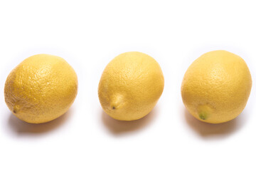 Three lemons on a white background