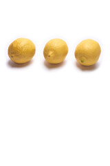 Three lemons on a white background