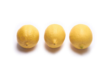 Three lemons on a white background