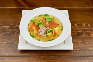 A plate of food sitting on top of a wooden table