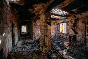 Burnt and collapsed old house interior. Consequences of fire