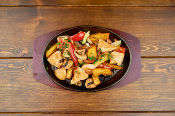A plate of food sitting on top of a wooden table