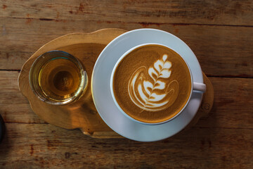 cup of coffee on wooden table