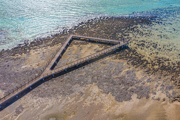Wooden boardwalk at Hamelin pool used for view at stromatolites, Australia