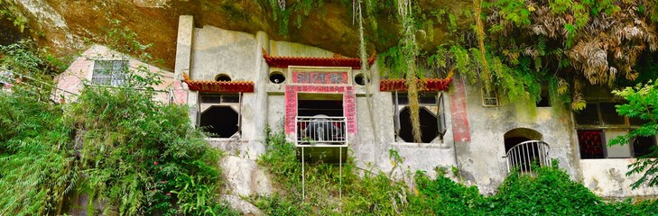 Yinhe Cave Temple, a cliffside Temple next to a gorgeous waterfall in the mountains, Xindian District, New Taipei, Taiwan