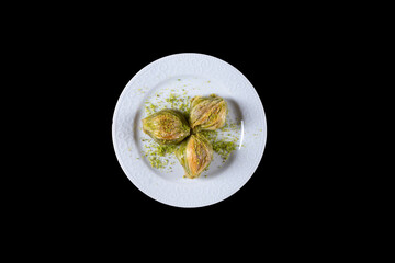 Pistachio baklava.  Traditional Dessert Baklava with pistachio. top view black background isolated
