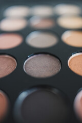 cosmetics and beauty, close-up of eyeshadow palette with neutral nude tones and shallow depth of field