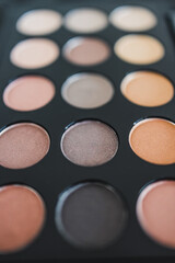cosmetics and beauty, close-up of eyeshadow palette with neutral nude tones and shallow depth of field