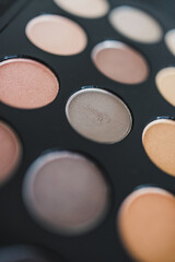 cosmetics and beauty, close-up of eyeshadow palette with neutral nude tones and shallow depth of field