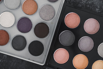 cosmetics and beauty, close-up of two similar eyeshadow palettes with neutral nude tones next to...