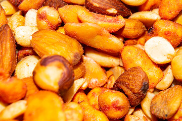 A mixture of different nuts. Healthy food, fitness diet. Surface texture. Close up.