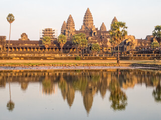 The iconic towers of Angkor Wat and the lake at the west gate - Siem Reap, Cambodia