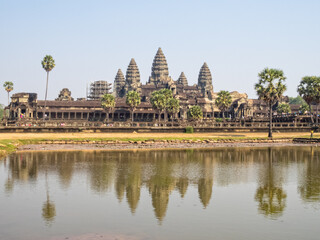 The iconic towers of Angkor Wat and the lake at the west gate - Siem Reap, Cambodia