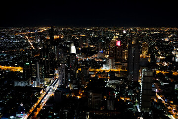 Fototapeta na wymiar Bangkok, Thailand, view from the observation deck King Power Mahana Khon, contrasting night city from above