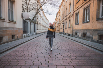 Young woman walking on European street
