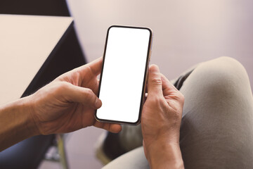 cell phone mockup image blank white screen.woman hand holding texting using mobile on desk at coffee shop.background empty space for advertise.work people contact marketing business,technology