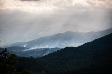 Smoke from cooking rising from the house of the Pakkayo hill tribe in which the house is located in the forest In the mountains