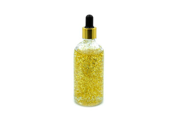 Dropping serum collagen moisturizer of face into clear yellow bottle soft light background. Protector skin Treatment facial essence oil, Vitamin C. Beauty and spa Concept