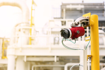 Gas detector station on oil and gas plant and monitor gas leaked around the production process for alarm in fire case. With warm light.