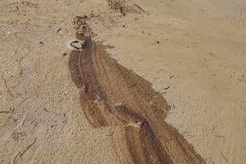 Oil contamination on a sandy ground