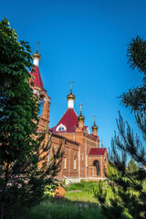 Fototapeta na wymiar Golden cross on the dome of an Orthodox church close-up.