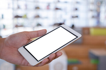 Woman holding a smartphone. Mobile screen is a white to make illustrations.