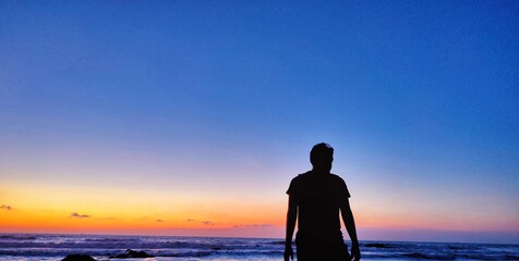 silhouette of a man on the beach