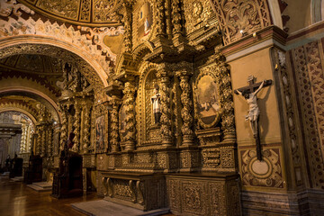 Fototapeta na wymiar Gold wood carving in the La compañia de Jesus church walls