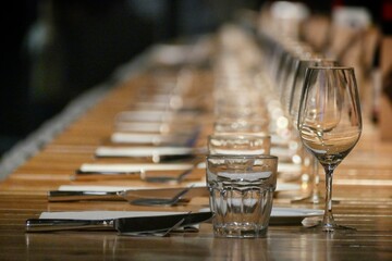 Long raw of restaurant table setting perspective view selective focus
