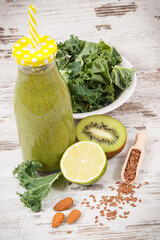 Freshly blended green coctail from fruits with vegetables and other ingredients. Healthy dessert...