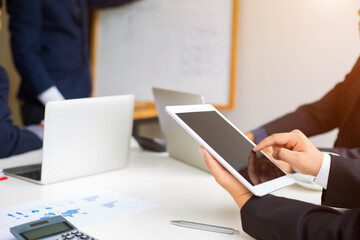 Business group or business partners discussing documents and ideas at meeting 