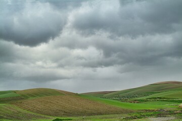 Lonely Art Nature Hills under cloudy sky stormy weather