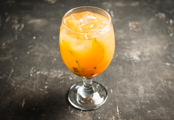 Orange cocktail on rustic background. Selective focus. Shallow depth of field.
