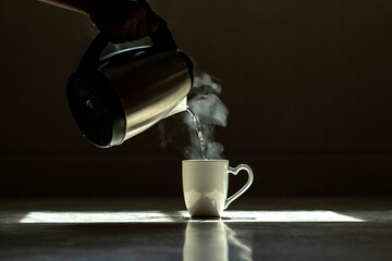 The steam from pouring boiling water into a glass to make coffee or tea.