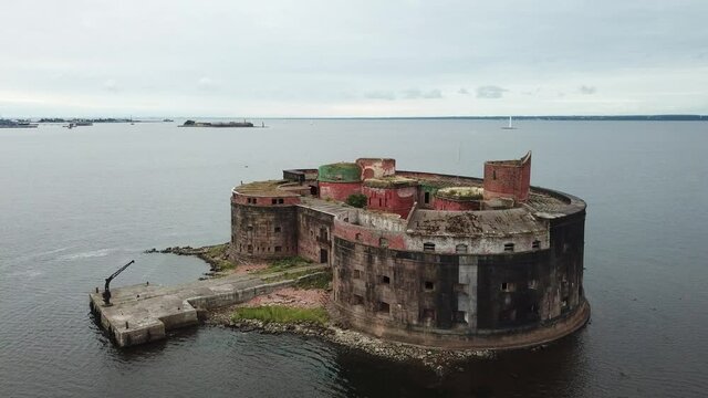 4K aerial cloudy morning video of Fort Alexander 1 bastion, its fortifications, armaments and Baltic Sea Finnish Bay panorama near Kronstadt and Saint Petersburg in northern Russia
