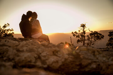 Couple looking at sunset in love