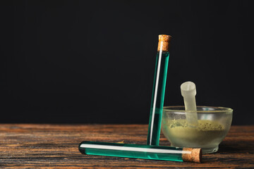 Mortar, pestle and potions on alchemist's table